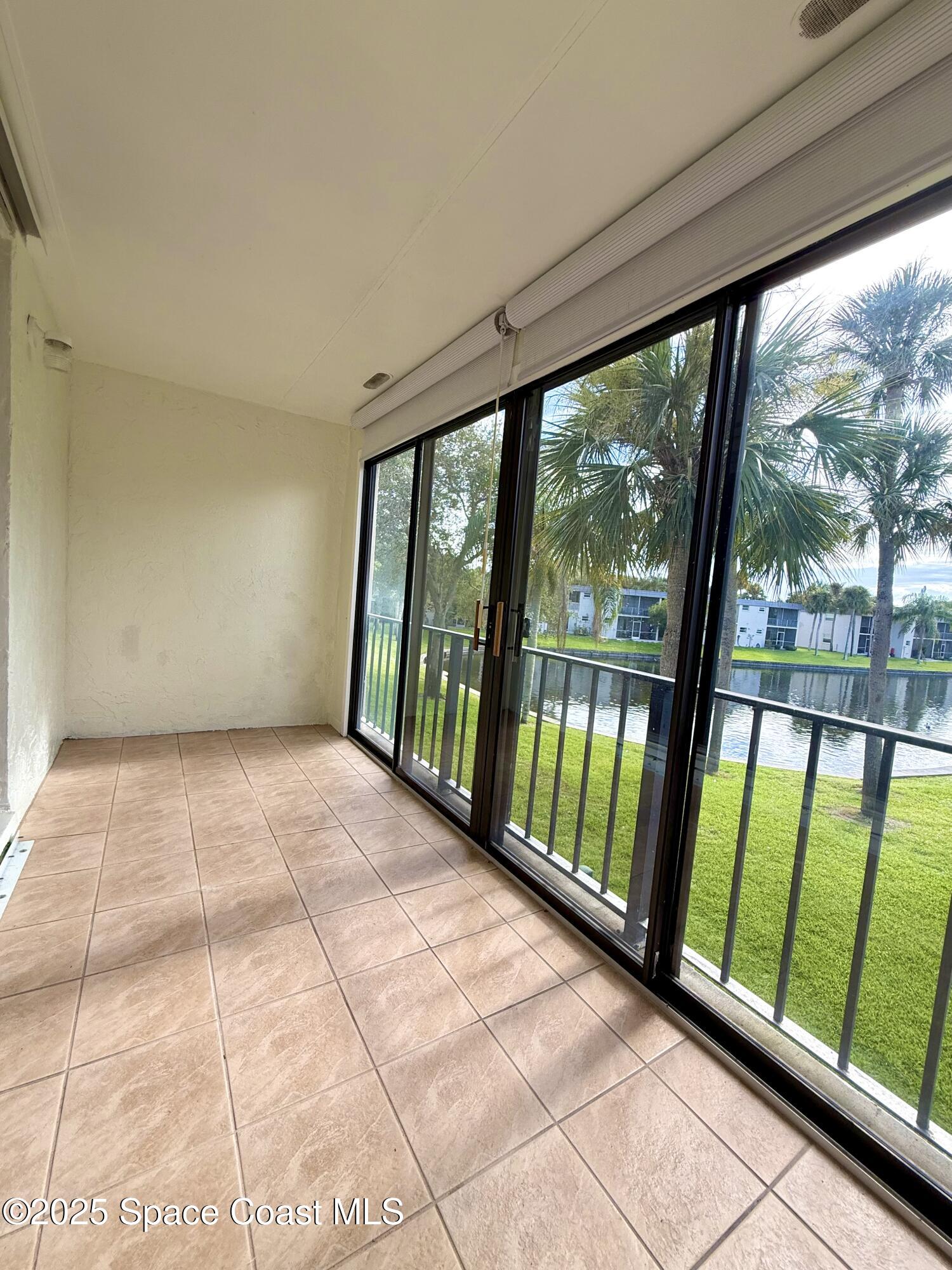 417 Ibis Lane, Unit 96 Satellite Beach, FL 32937 - Photo 25 of 29 a view of a room with large windows