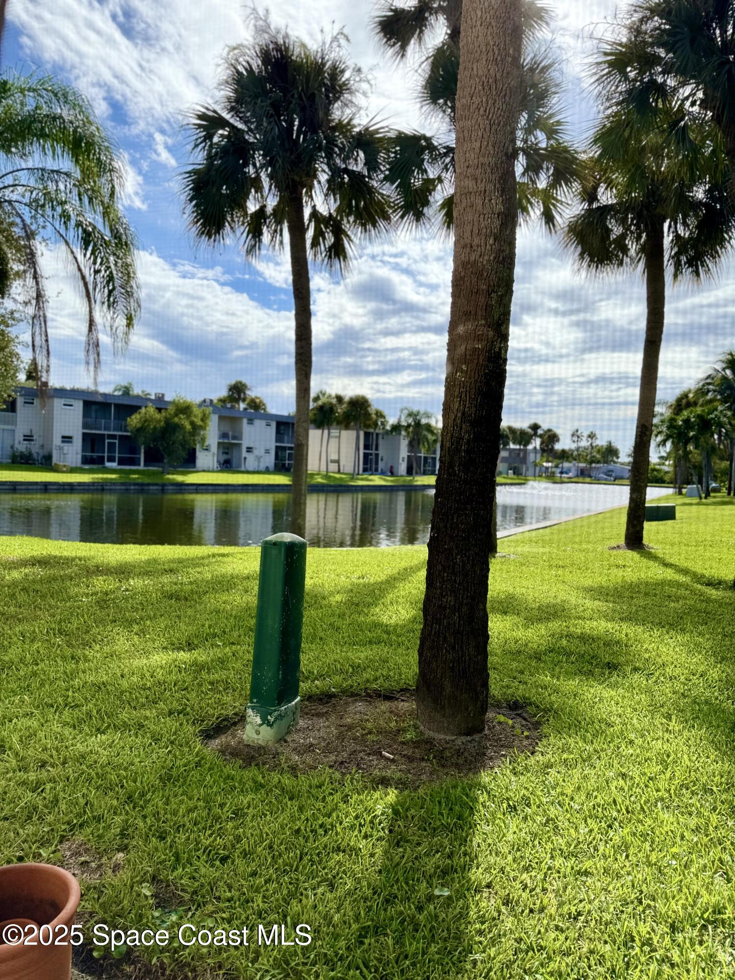 417 Ibis Lane, Unit 96 Satellite Beach, FL 32937 - Photo 27 of 29 a view of a park with a tree