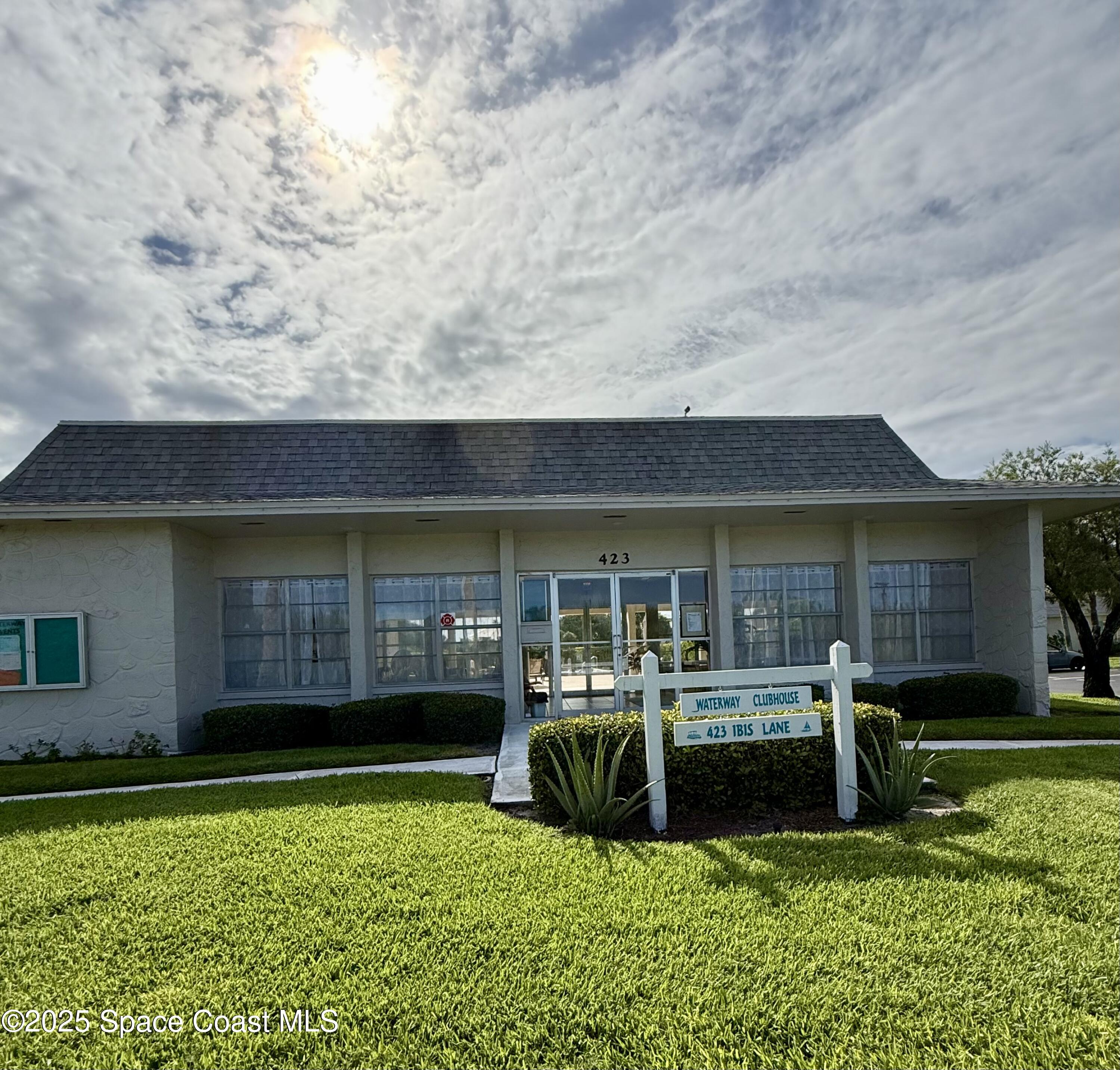 417 Ibis Lane, Unit 96 Satellite Beach, FL 32937 - Photo 28 of 29 a view of a house with backyard porch and sitting area