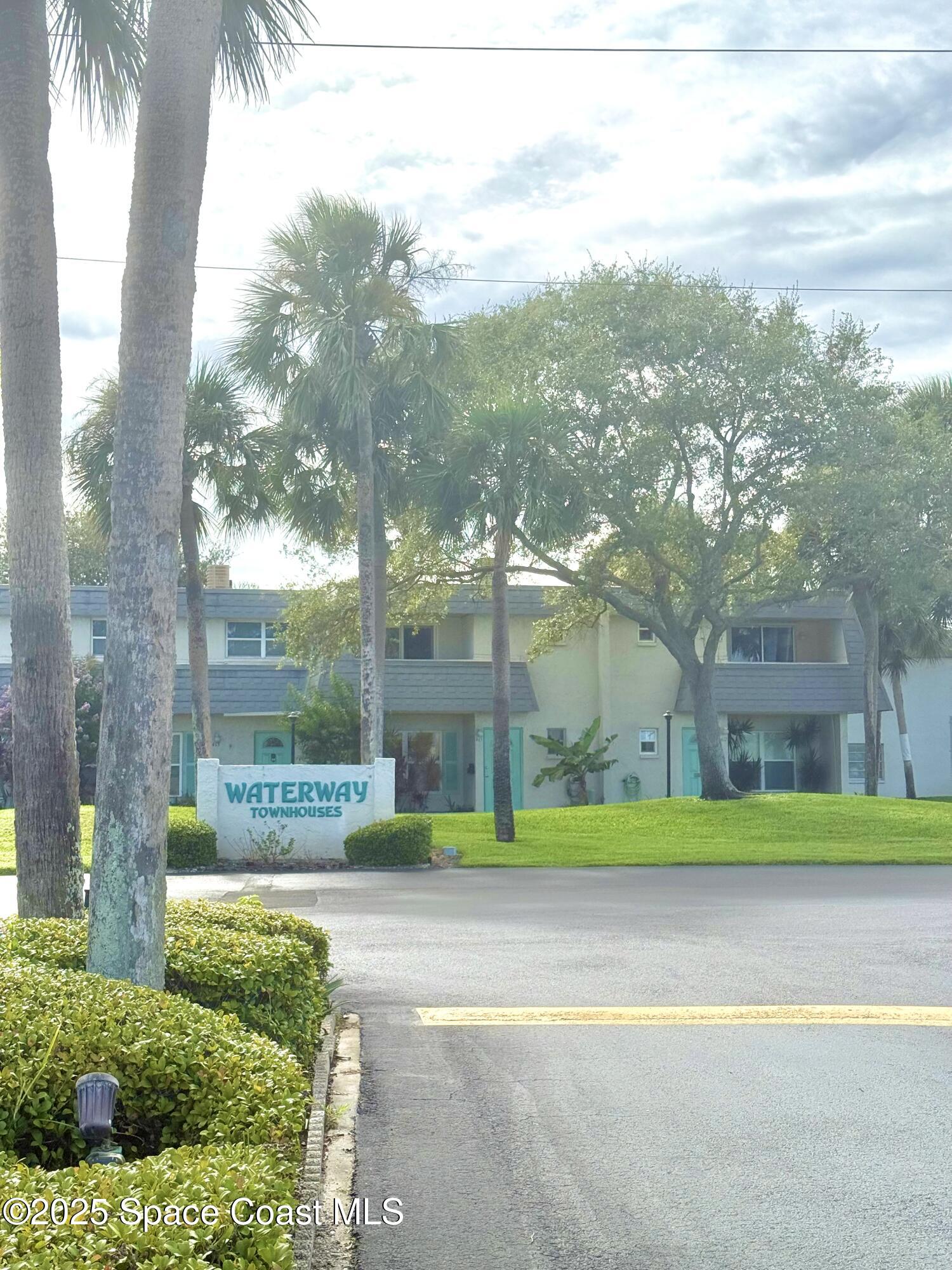 417 Ibis Lane, Unit 96 Satellite Beach, FL 32937 - Photo 3 of 29 a view of a yard