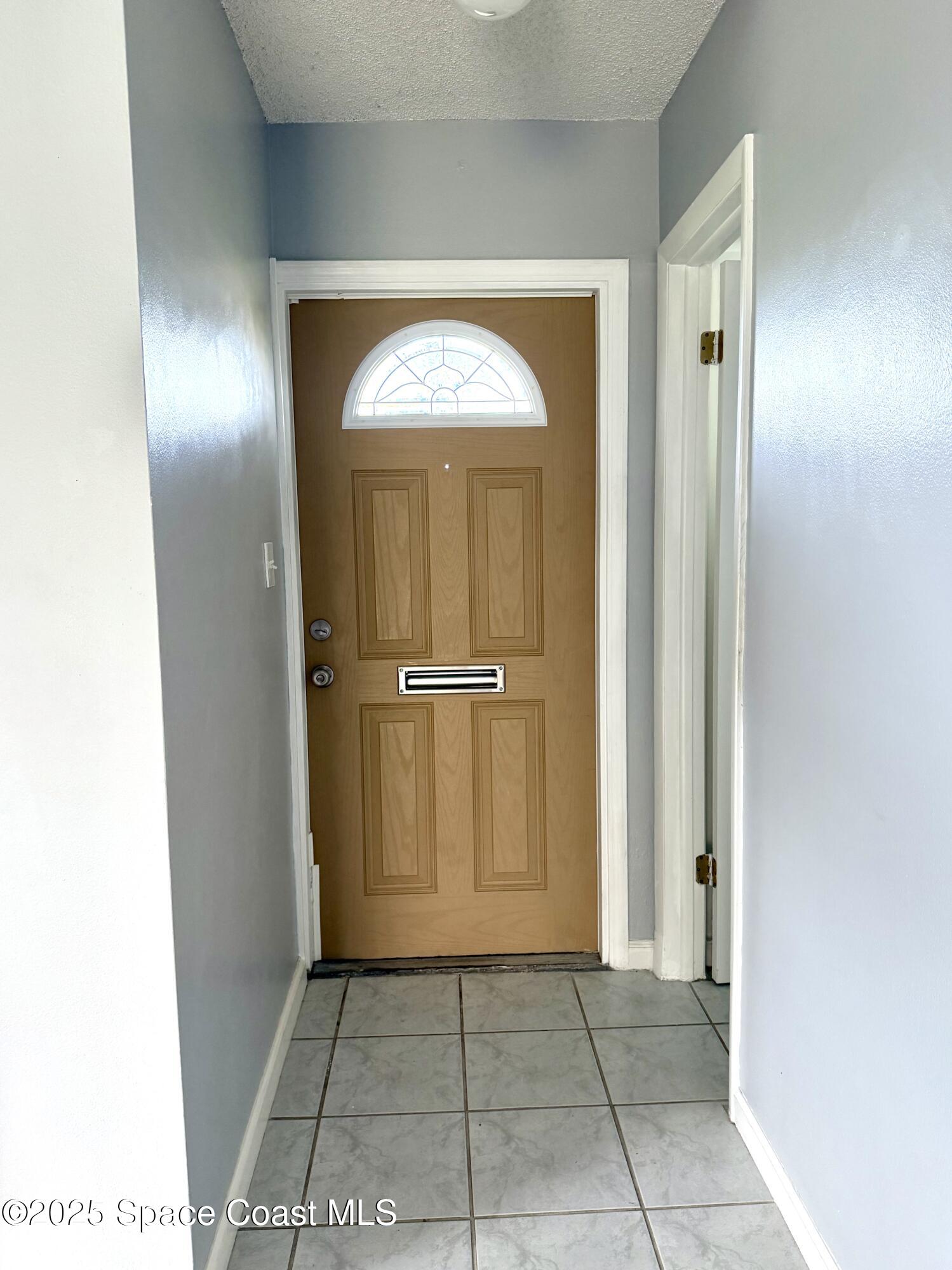417 Ibis Lane, Unit 96 Satellite Beach, FL 32937 - Photo 4 of 29 a view of an entryway door