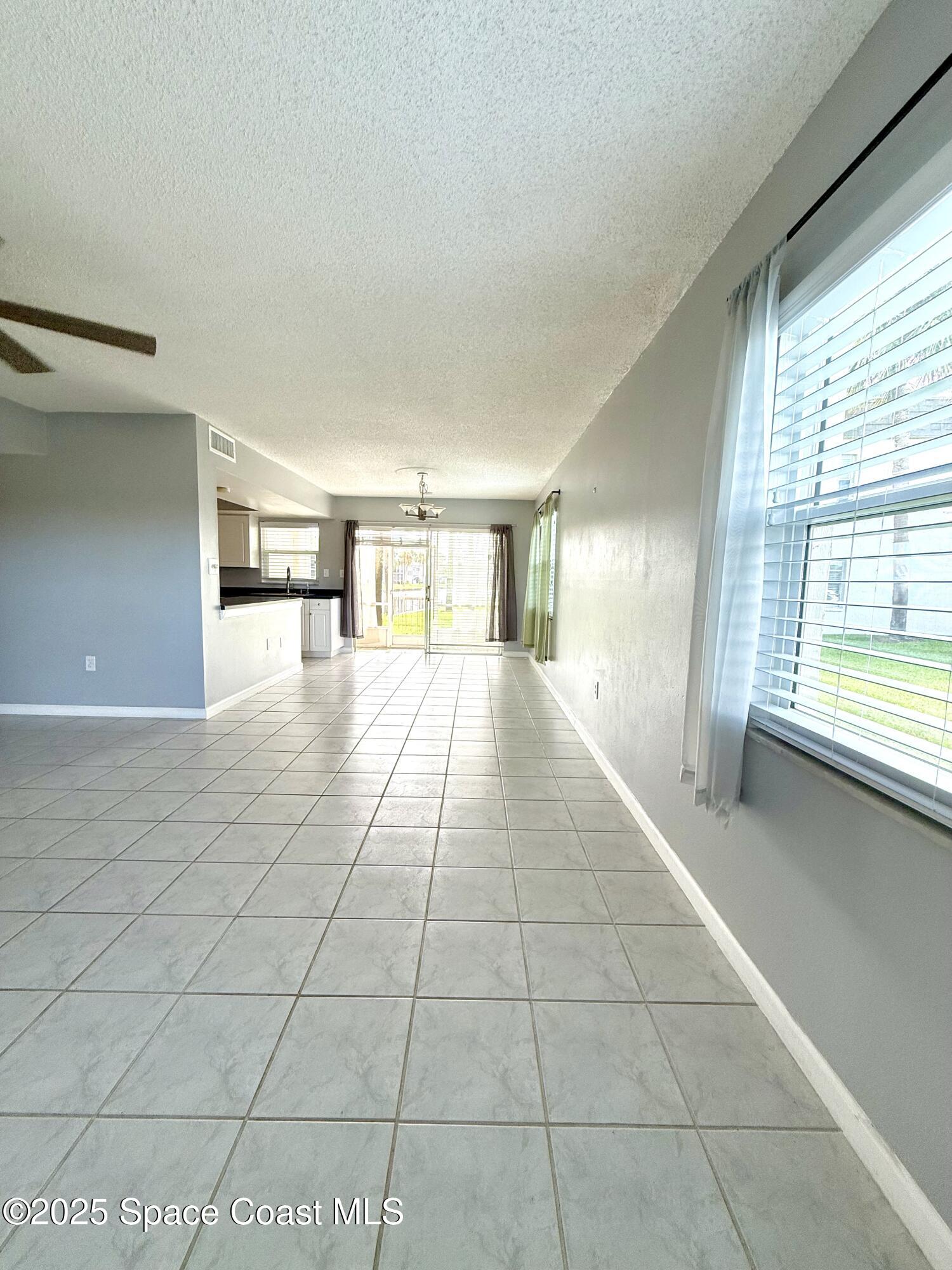 417 Ibis Lane, Unit 96 Satellite Beach, FL 32937 - Photo 5 of 29 a view of an empty room and window