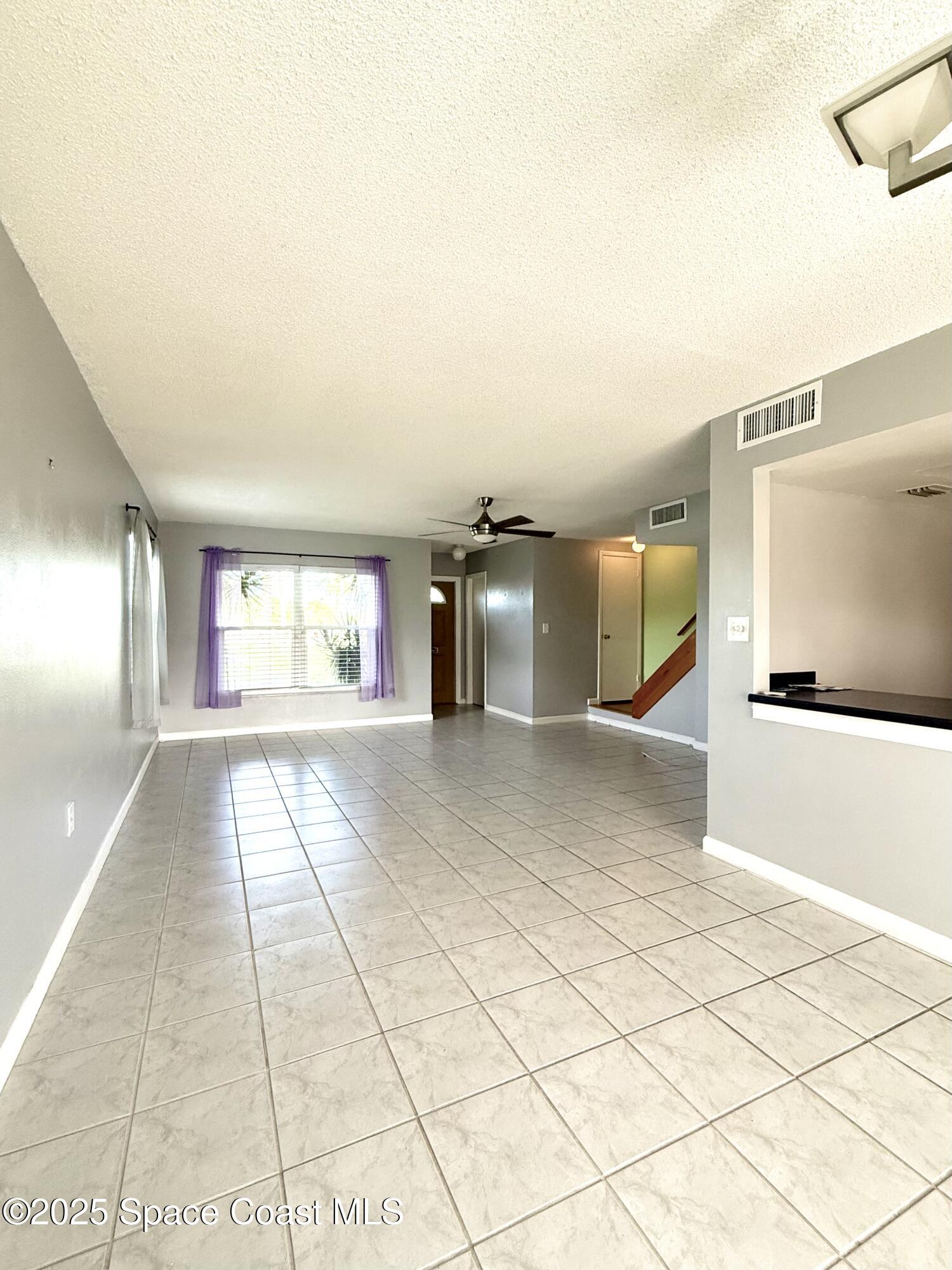 417 Ibis Lane, Unit 96 Satellite Beach, FL 32937 - Photo 6 of 29 a view of a hallway with an empty room