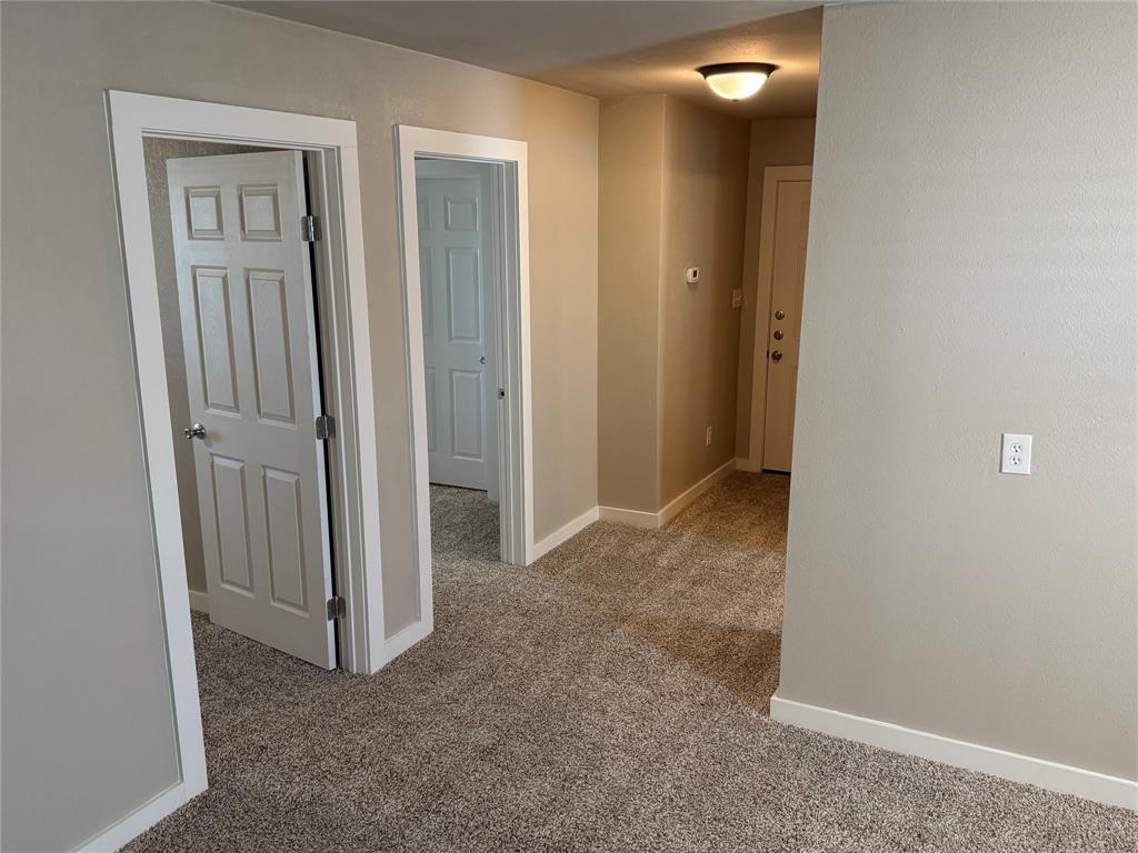 10109 Clark Airfield Road Justin, TX 76247 - Photo 11 of 24 Another angle looking from the dining room to the "downstairs" part of the home. All of this space was added to the little home once it was moved to this place. There are two bedrooms, a bathroom and this bonus space "downstairs".