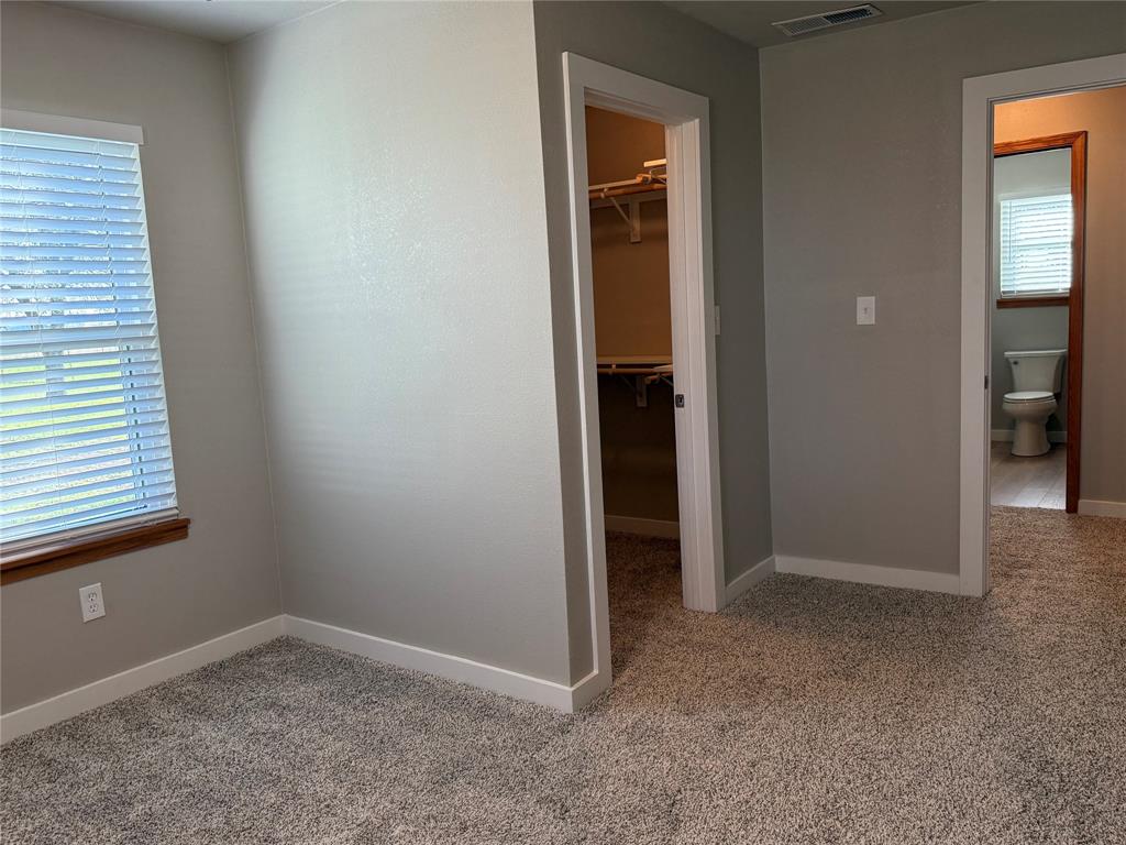 10109 Clark Airfield Road Justin, TX 76247 - Photo 16 of 24 Another angle on the biggest bedroom. You can see the closet and the bathroom across the hall.
