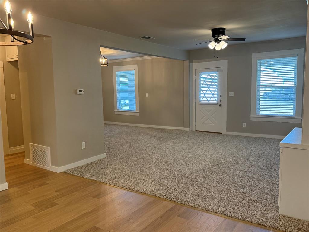 10109 Clark Airfield Road Justin, TX 76247 - Photo 19 of 24 Back in the dining room looking towards the living room and the hallway to another bedroom and bathroom.