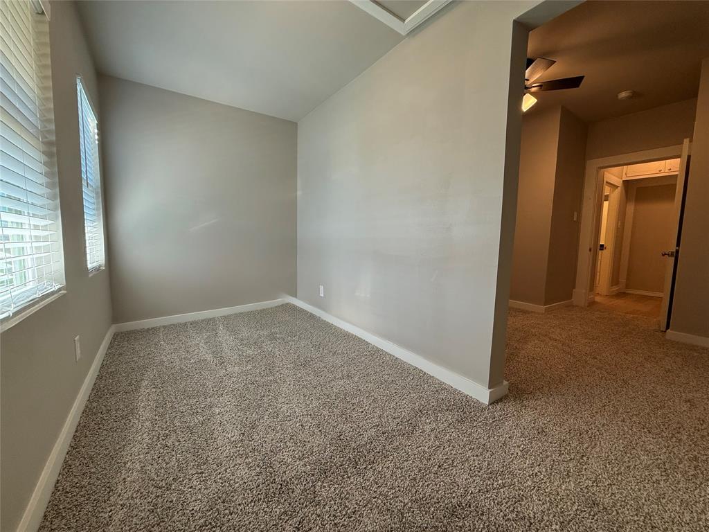 10109 Clark Airfield Road Justin, TX 76247 - Photo 22 of 24 This is a bonus space off the upstairs bedroom. This could be used as a nursery or a play room or a big closet and dressing room. So many things you could do with this. You can see the bedroom and the bathroom beyond.