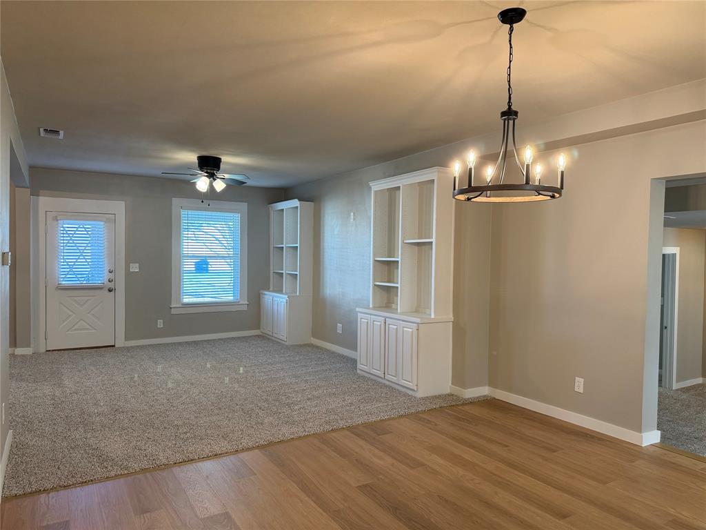 10109 Clark Airfield Road Justin, TX 76247 - Photo 3 of 24 This perspective is from the dining area looking back towards the living room and front door.
