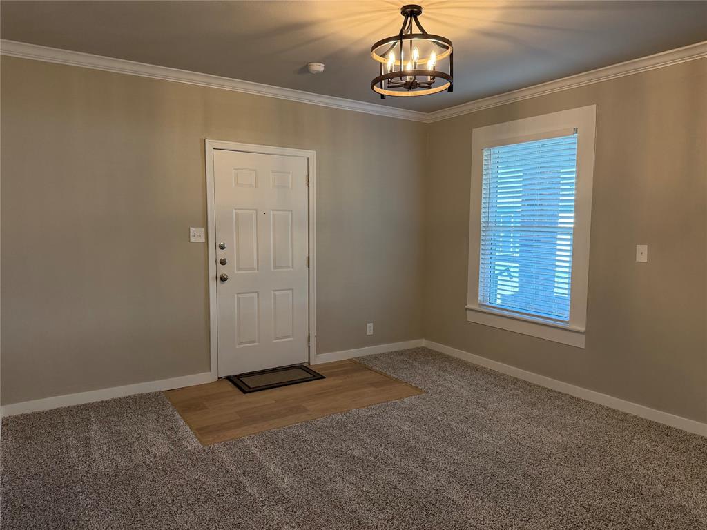 10109 Clark Airfield Road Justin, TX 76247 - Photo 4 of 24 This is a bonus room off the living room. The door goes out to the garage.