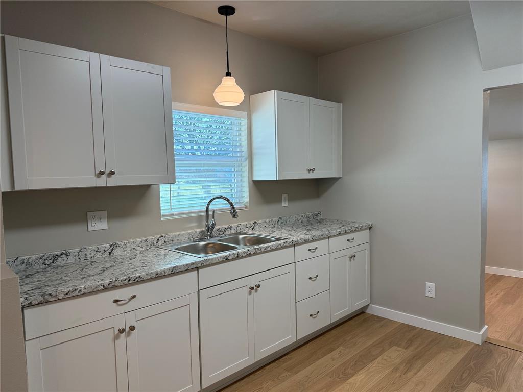 10109 Clark Airfield Road Justin, TX 76247 - Photo 5 of 24 All new cabinets and countertops - new kitchen sink and faucet.
