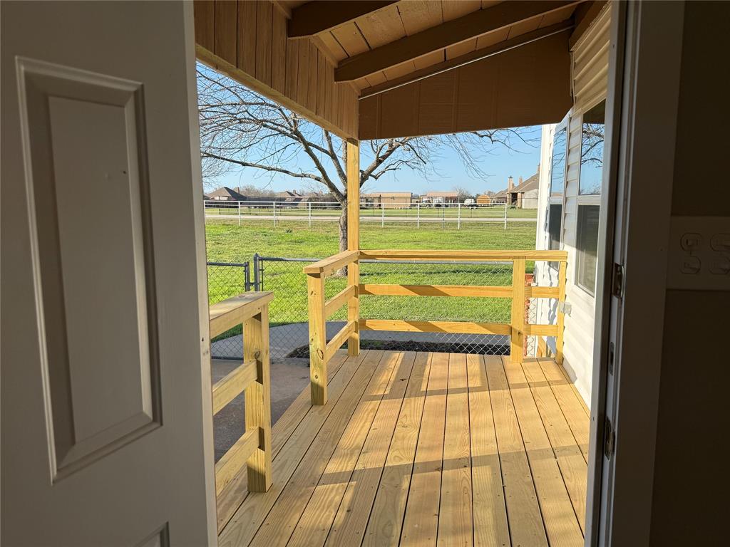 10109 Clark Airfield Road Justin, TX 76247 - Photo 8 of 24 The back door from the laundry room to the back deck. String lights coming soon! Perfect spot for a grill and a couple of chairs!