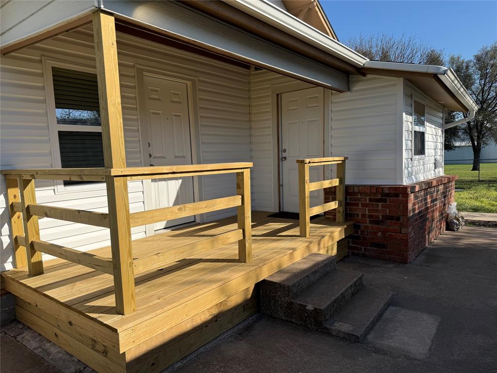 10109 Clark Airfield Road Justin, TX 76247 - Photo 9 of 24 Another angle on the back porch. This home has a little fenced in back yard. Lawn care included in rent.