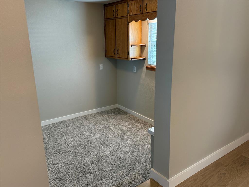 10109 Clark Airfield Road Justin, TX 76247 - Photo 10 of 24 From the dining area looking into the "downstairs" sitting area. This space could be used in so many ways. It could be a playroom, a home office, a work-out space. etc.