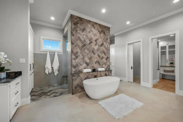 a spacious bathroom with a double vanity sink a mirror and shower