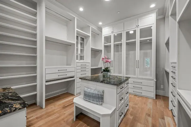 a kitchen with stainless steel appliances granite countertop a stove and a refrigerator