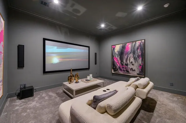 a bedroom with furniture and a flat screen tv