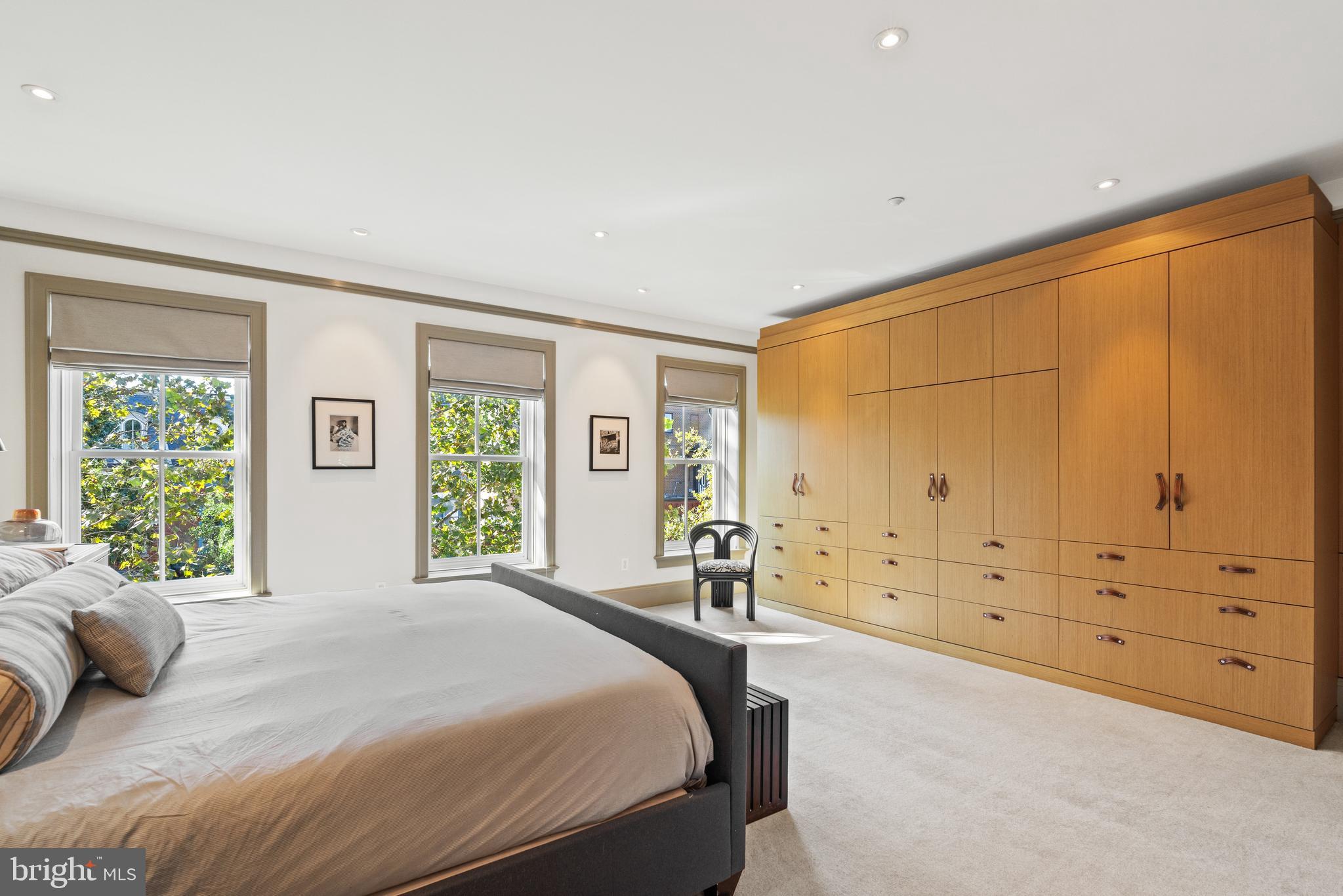 1341 Q Street Northwest, Unit B Washington, DC 20009 - Photo 16 of 31 a spacious bedroom with a large bed and a window