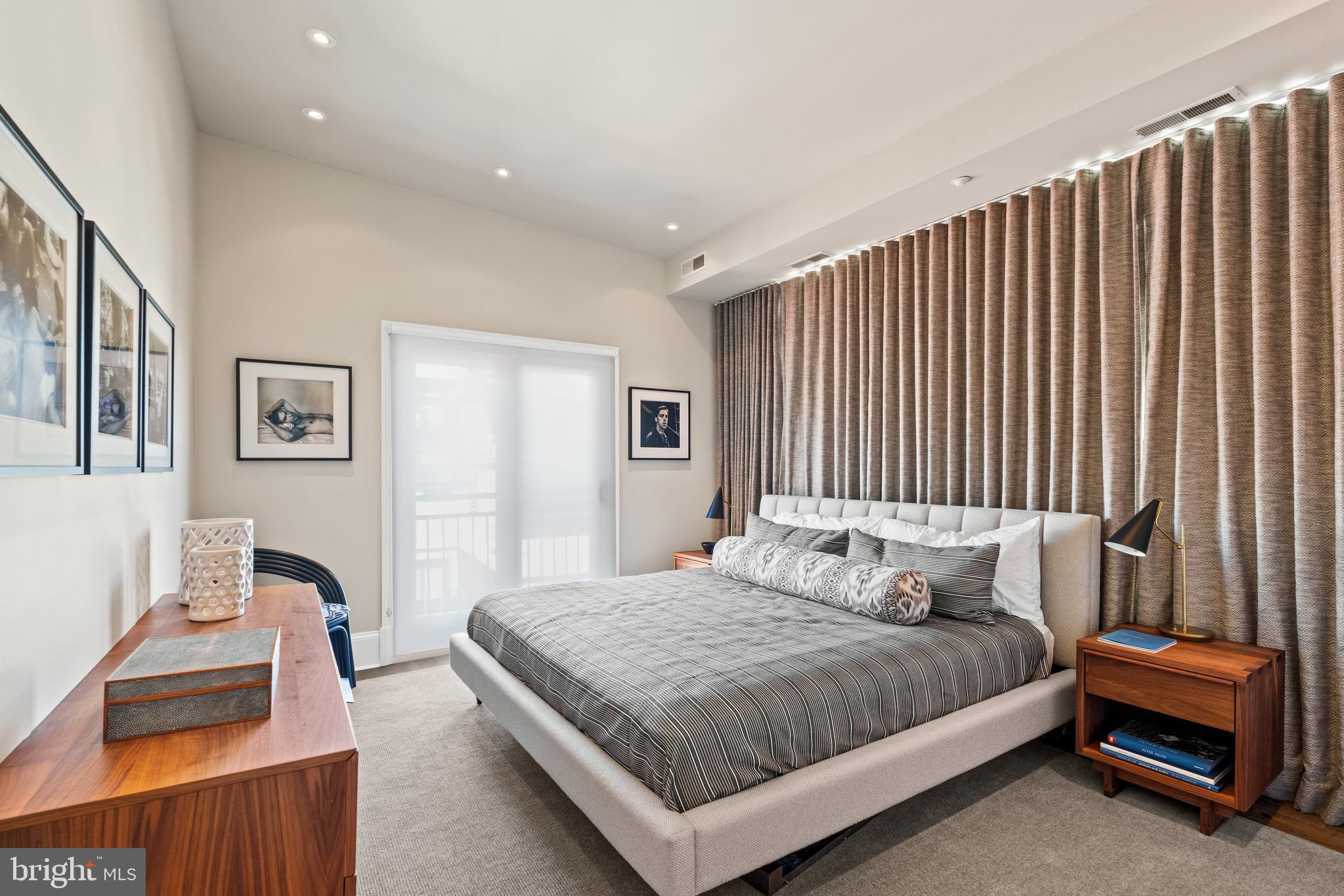 1341 Q Street Northwest, Unit B Washington, DC 20009 - Photo 21 of 31 a bedroom with a bed and a couch