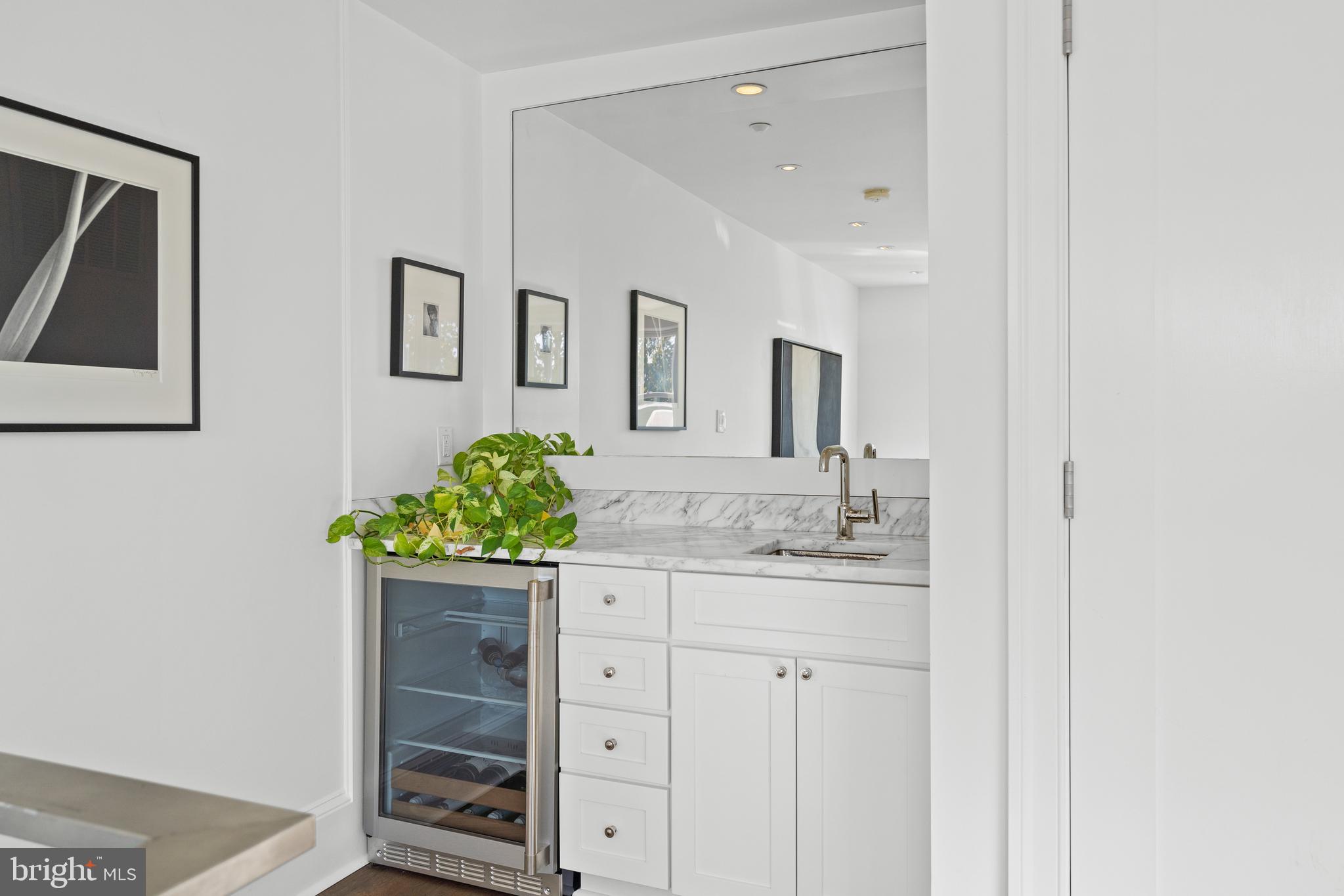 1341 Q Street Northwest, Unit B Washington, DC 20009 - Photo 25 of 31 a bathroom with a granite countertop sink and a mirror