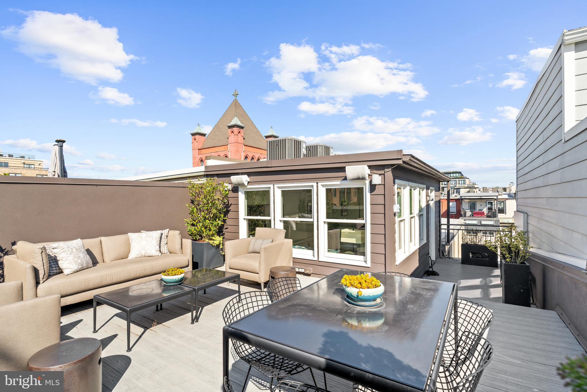 1341 Q Street Northwest, Unit B Washington, DC 20009 - Photo 28 of 31 a view of a dining table and chairs in the patio