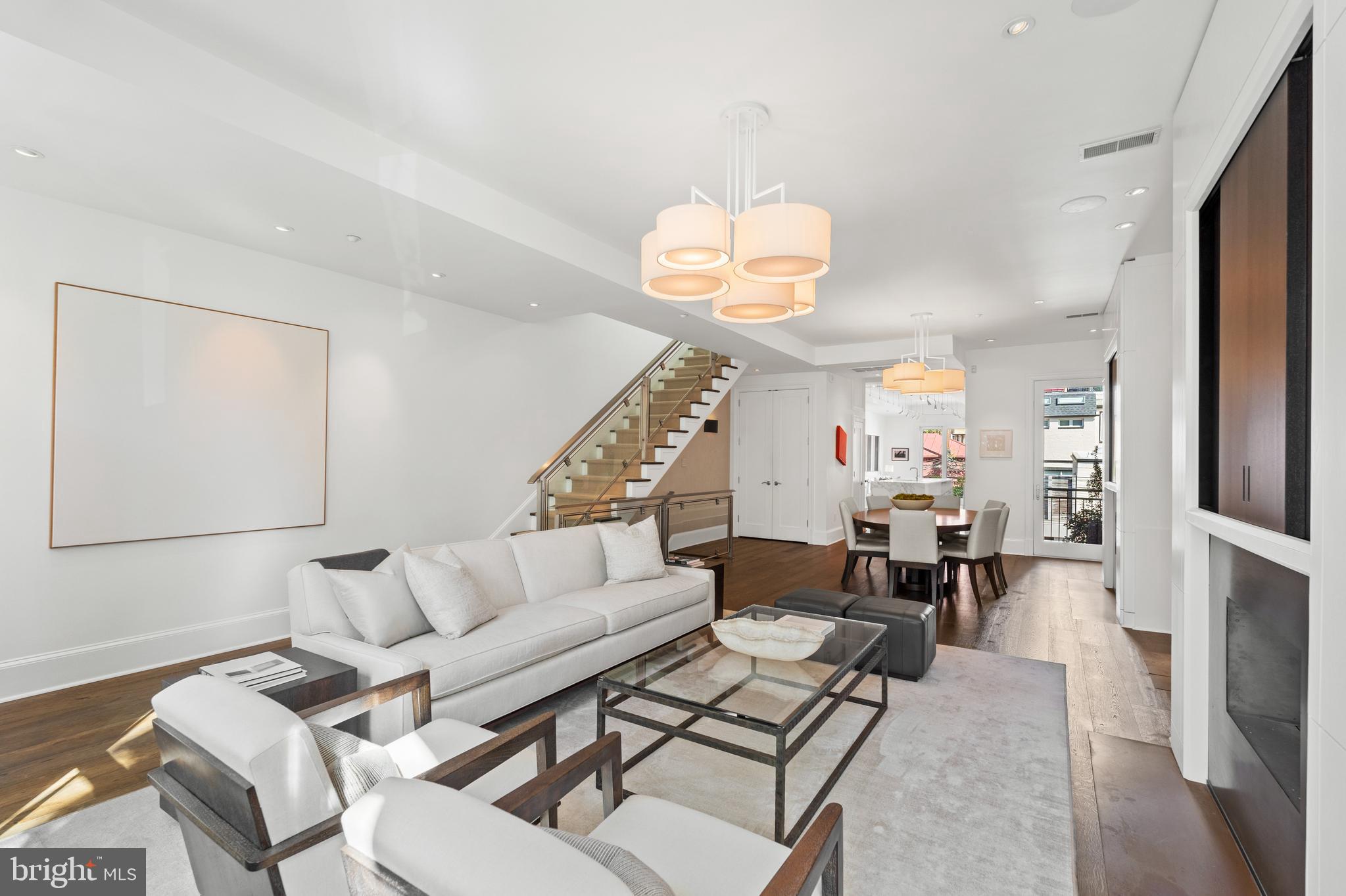 1341 Q Street Northwest, Unit B Washington, DC 20009 - Photo 6 of 31 a living room with furniture a chandelier and a dining table