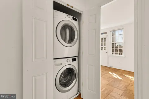a view of a hallway with washer and dryer
