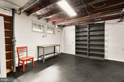 a view of an empty room with a staircase