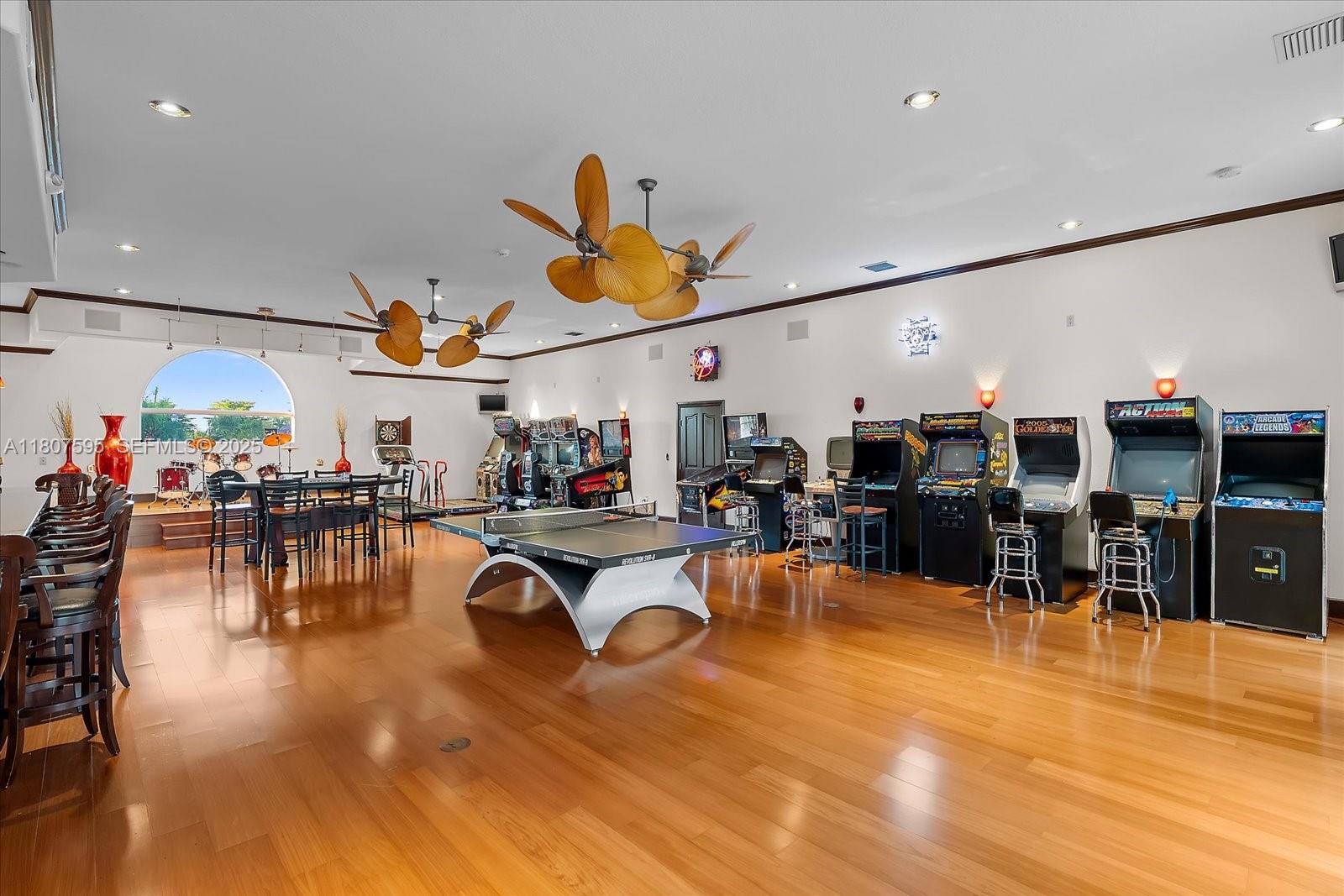 18451 Southwest 158th Street Miami, FL 33187 - Photo 14 of 45 a view of a swimming pool with a table and chairs