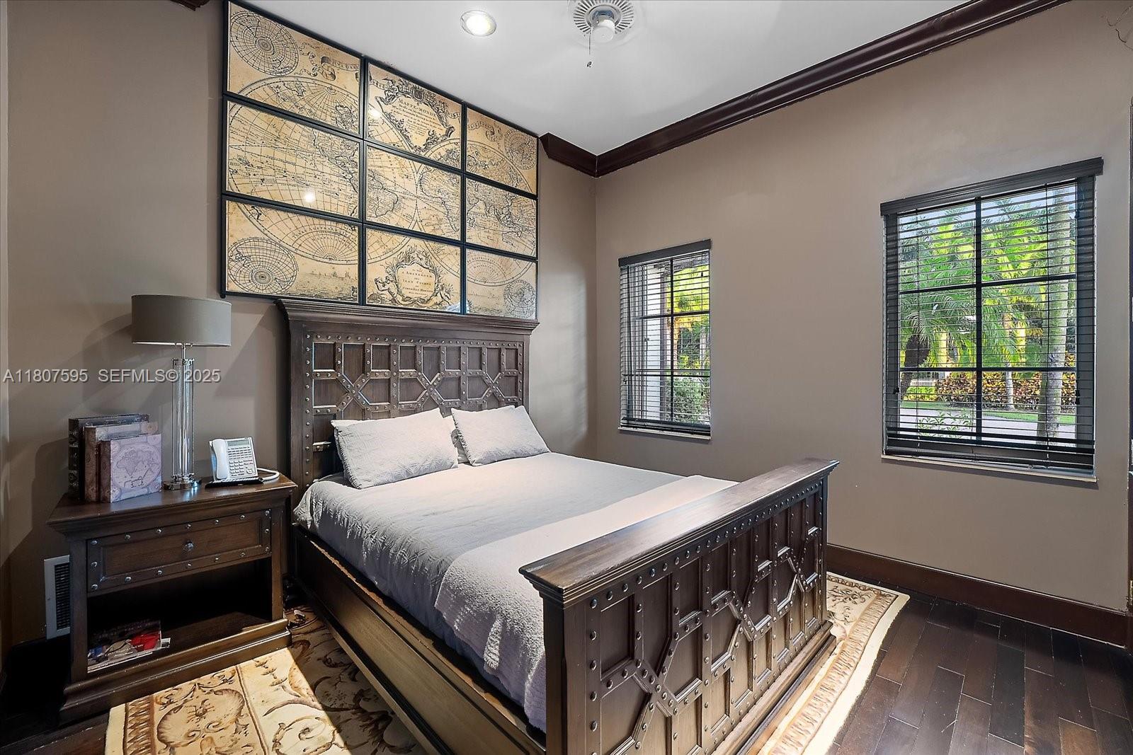 18451 Southwest 158th Street Miami, FL 33187 - Photo 19 of 45 a bedroom with a bed a dresser next to a window