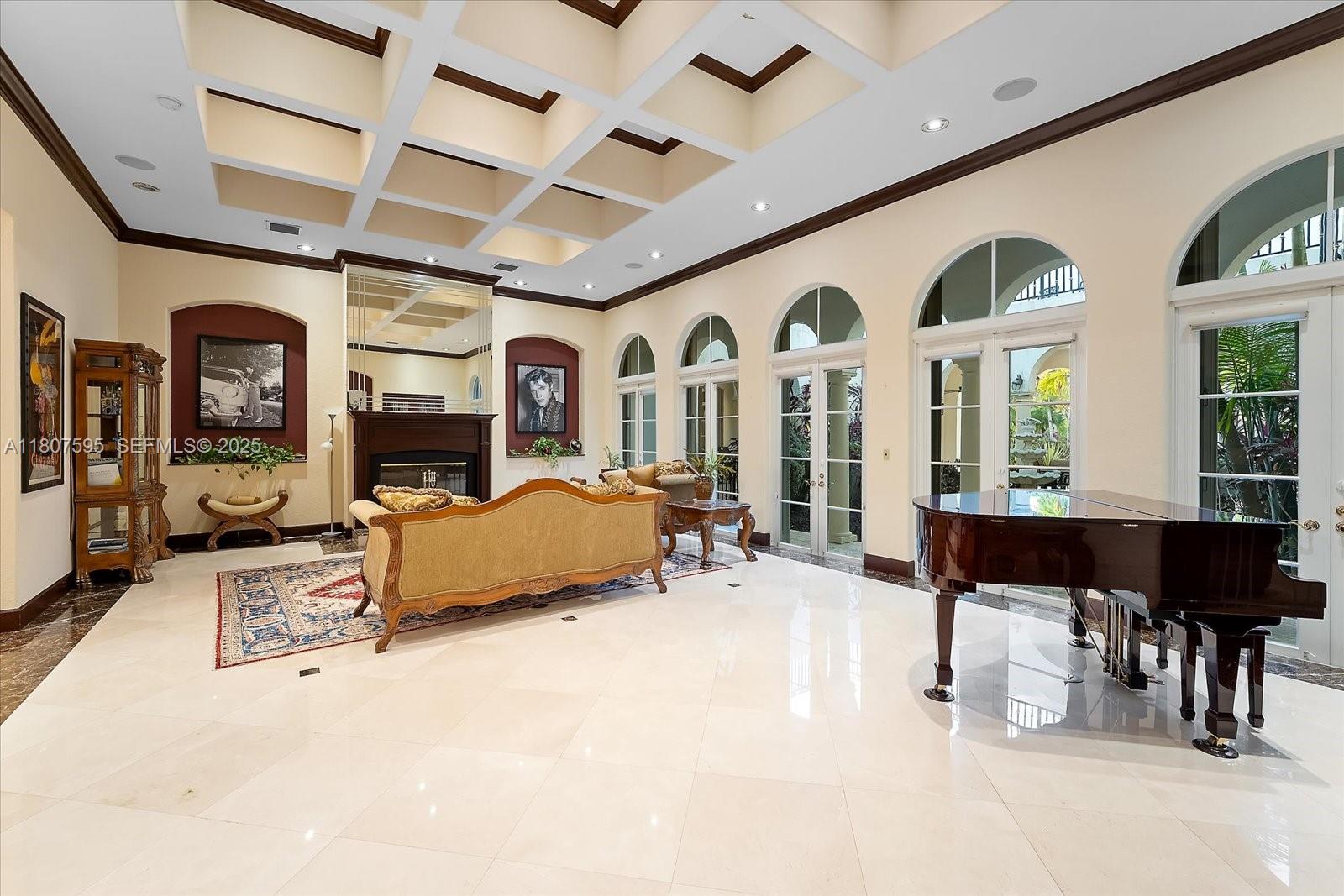 18451 Southwest 158th Street Miami, FL 33187 - Photo 20 of 45 a living room with furniture large window and flat screen tv