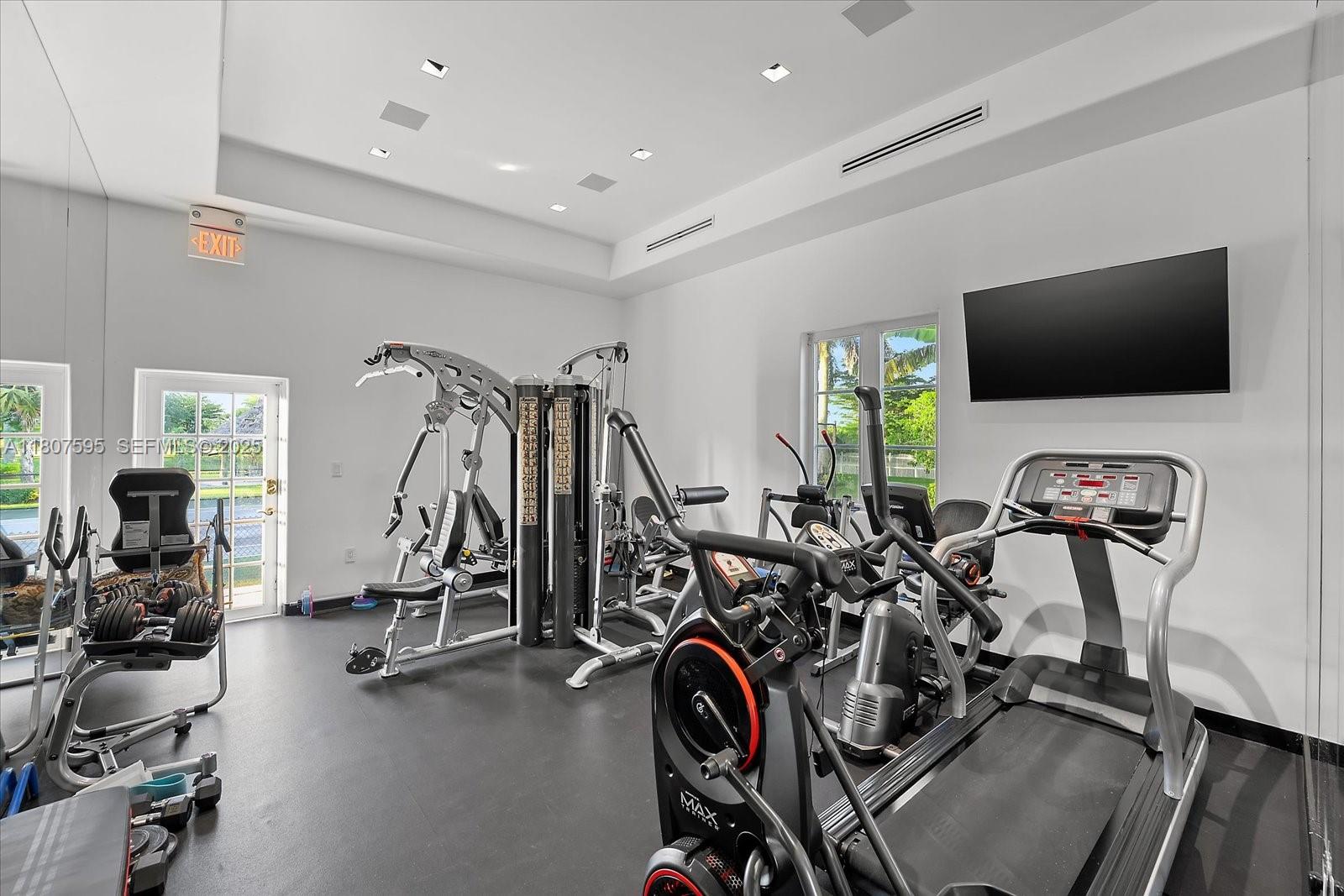 18451 Southwest 158th Street Miami, FL 33187 - Photo 30 of 45 a view of a room with gym equipment