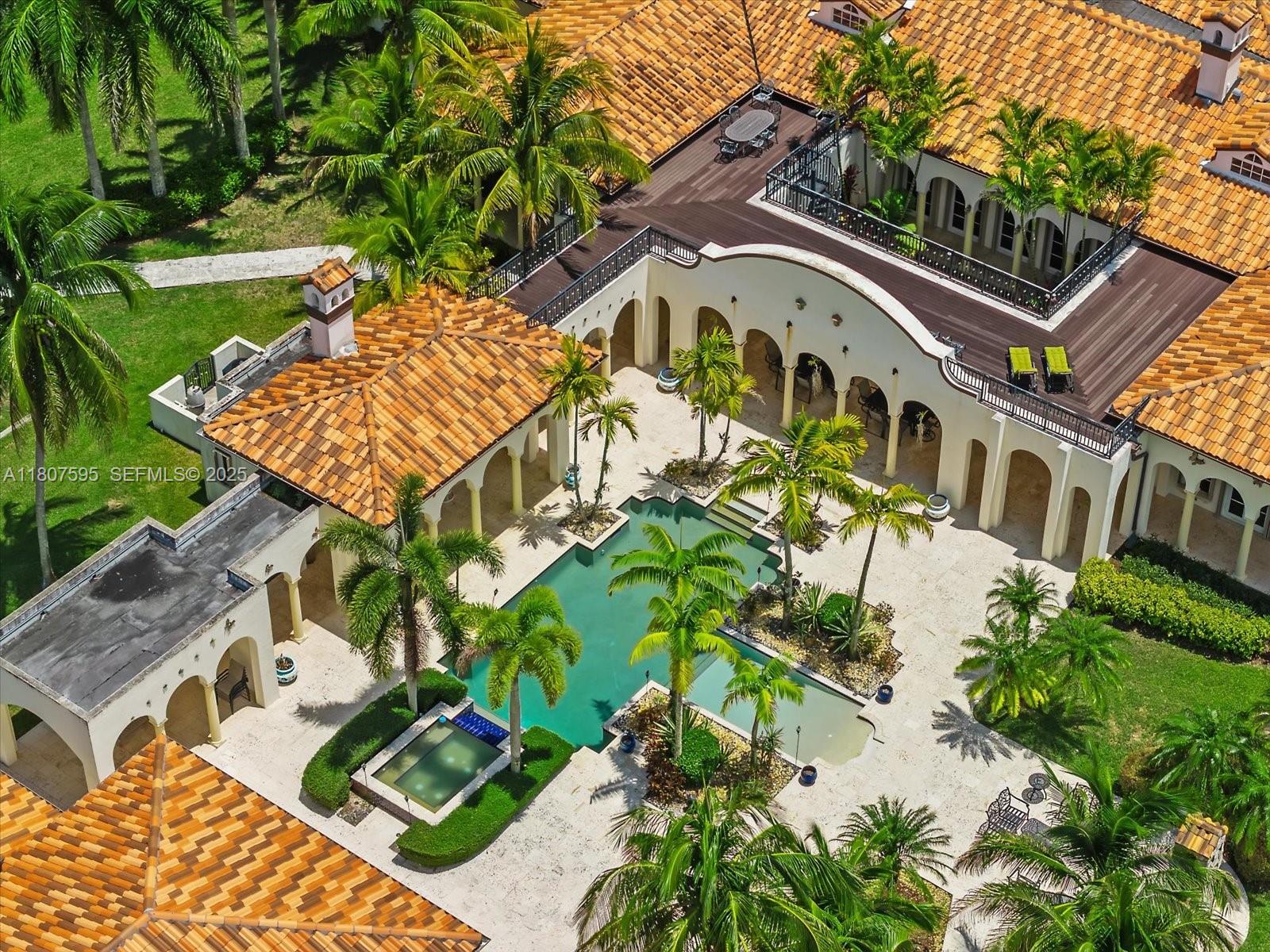 18451 Southwest 158th Street Miami, FL 33187 - Photo 38 of 45 an aerial view of a house with a yard and potted plants