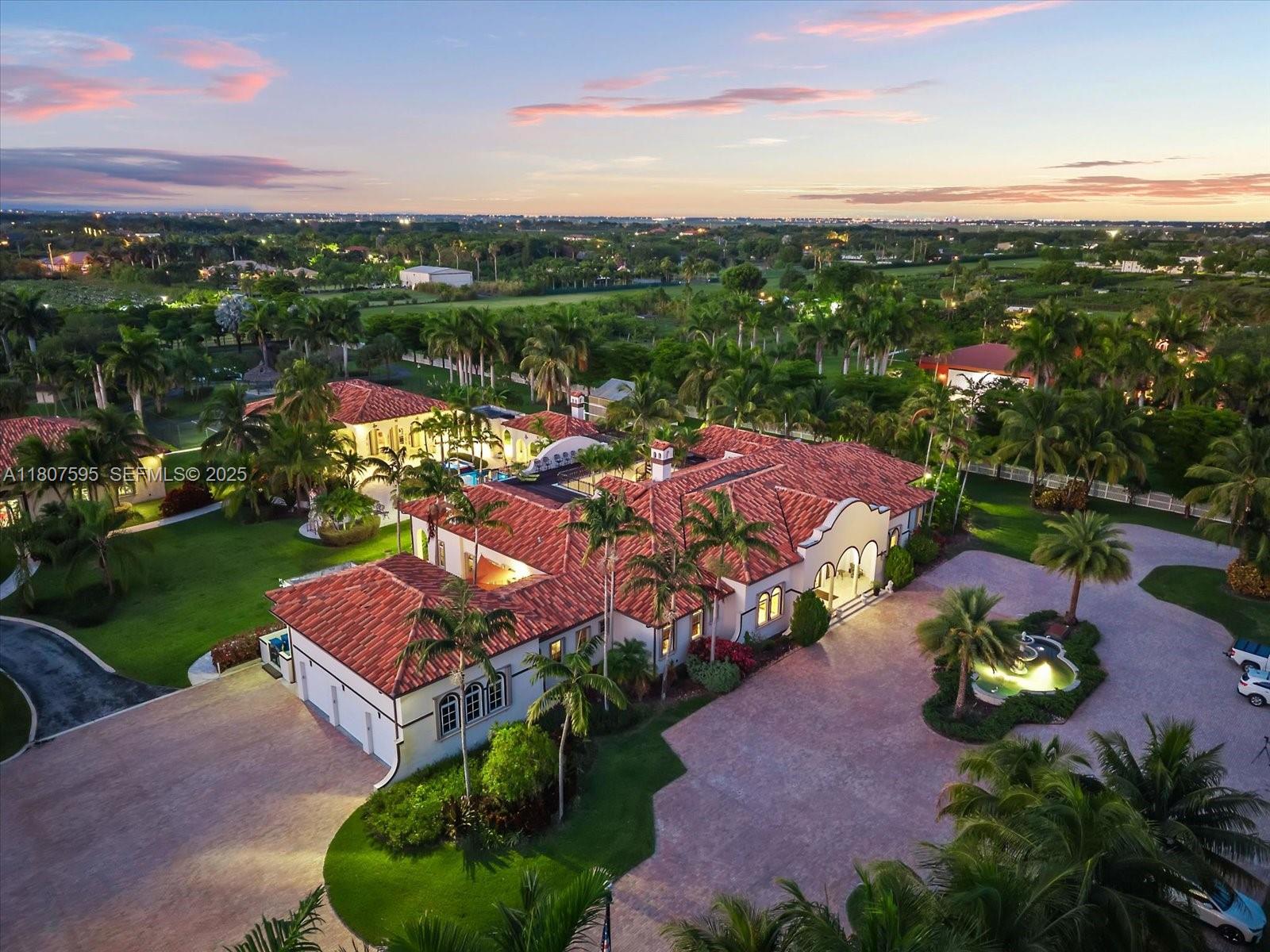 18451 Southwest 158th Street Miami, FL 33187 - Photo 4 of 45 a view of a lake with a yard