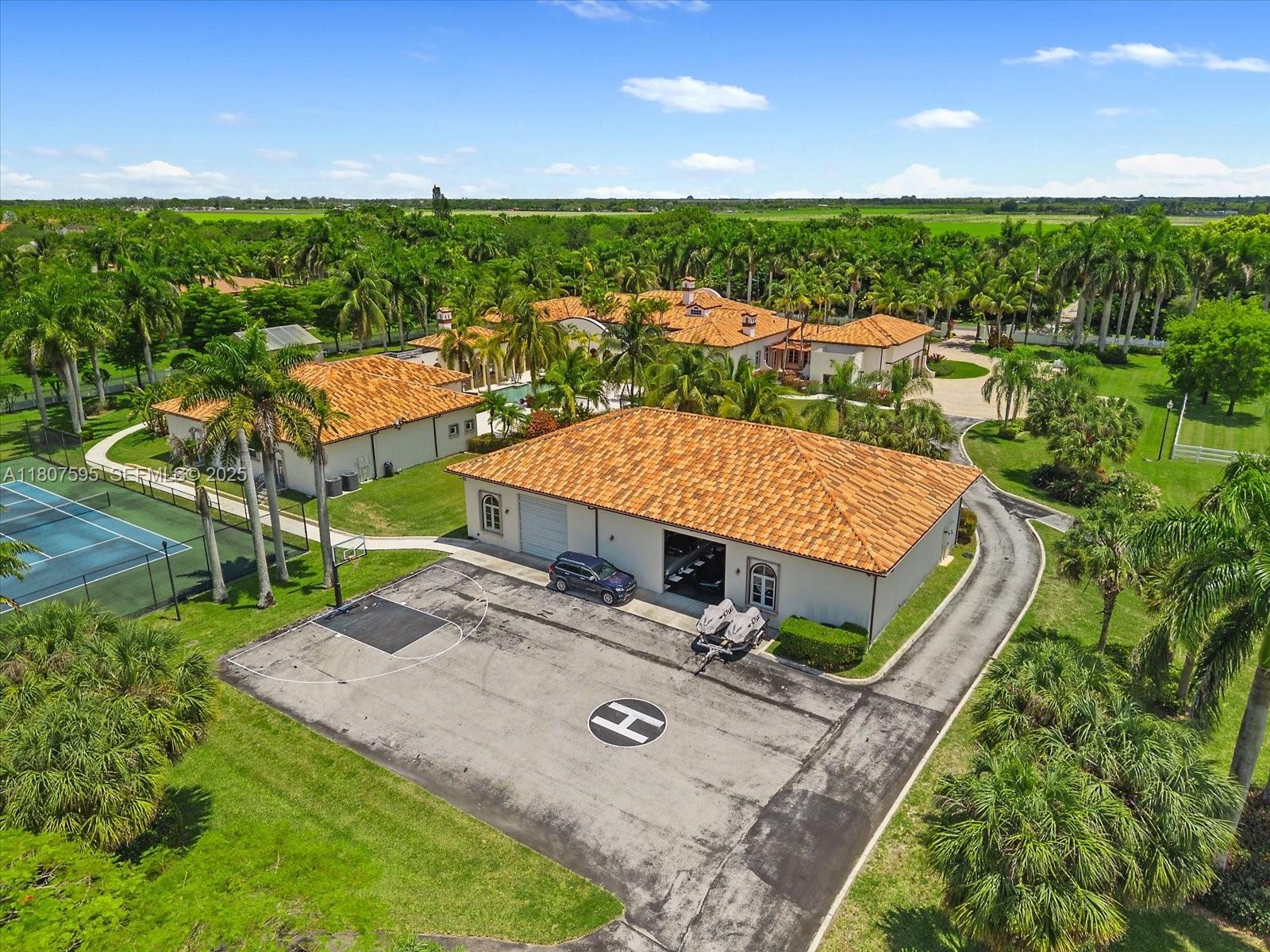 18451 Southwest 158th Street Miami, FL 33187 - Photo 43 of 45 an aerial view of a house with swimming pool garden and patio