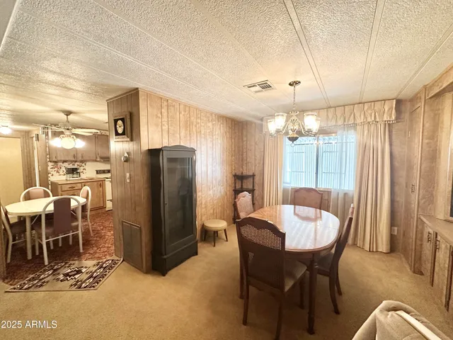 a kitchen with stainless steel appliances granite countertop a stove a sink dishwasher and a refrigerator with wooden floor