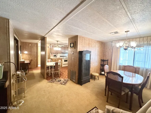 a kitchen with stainless steel appliances a refrigerator a sink and cabinets