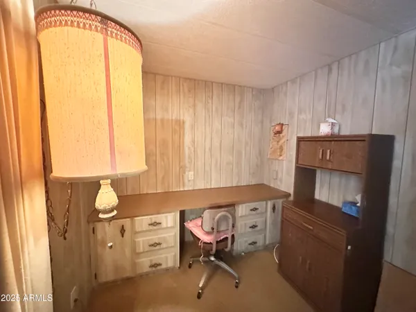 a bathroom with a sink a toilet a mirror and shower