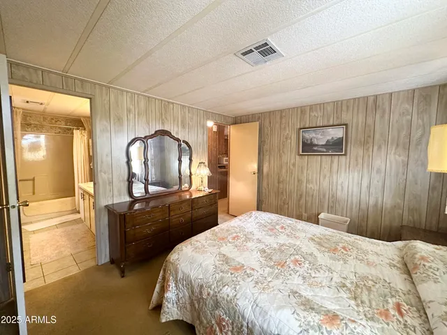 a view of a living room with furniture and a window