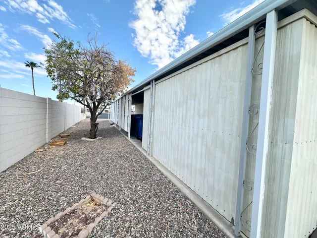 a view of a house with a tree