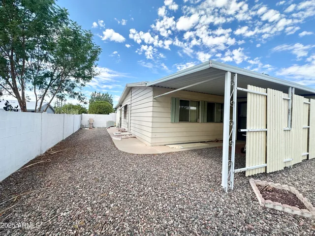 a backyard of a house with lots of green space