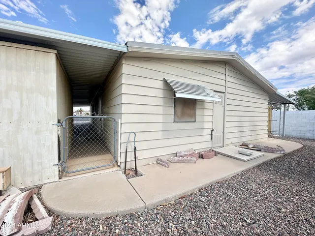 a view of a backyard with a tree