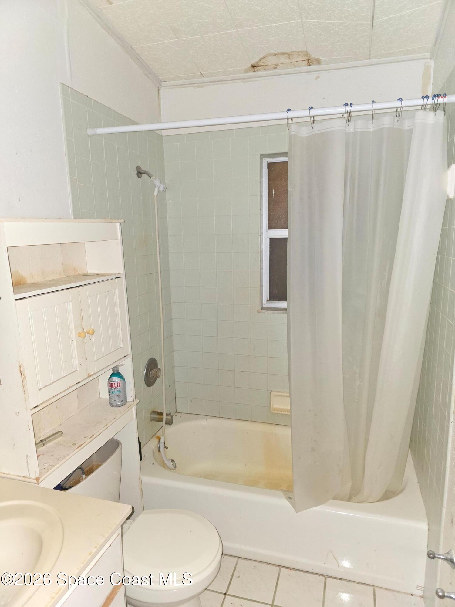 4365 Highway 1 Mims, FL 32754 - Photo 28 of 37 a bathroom with a toilet a sink and bathtub