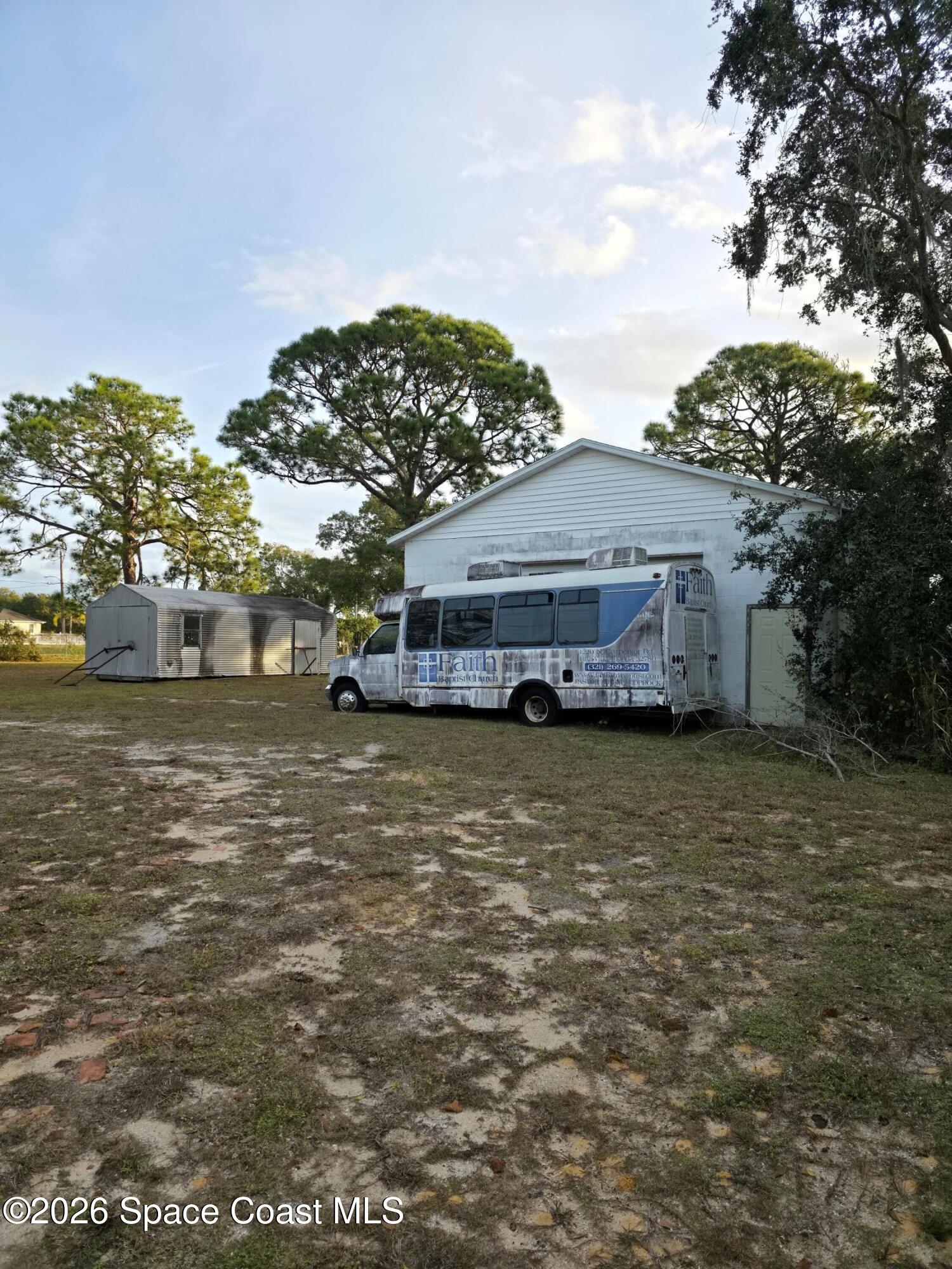 4365 Highway 1 Mims, FL 32754 - Photo 30 of 37 a bus parked in front of a house
