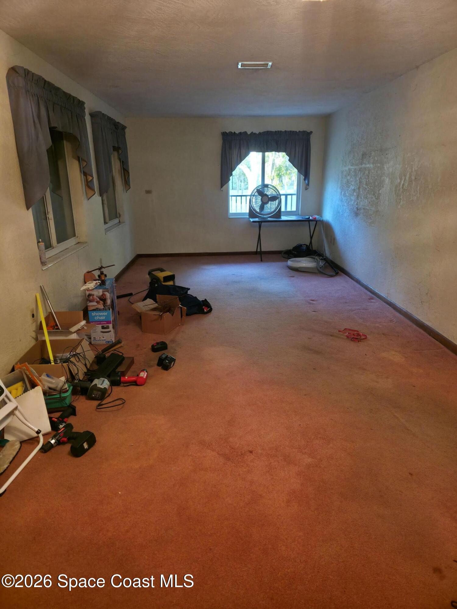 4365 Highway 1 Mims, FL 32754 - Photo 9 of 37 a room with gym equipment and windows