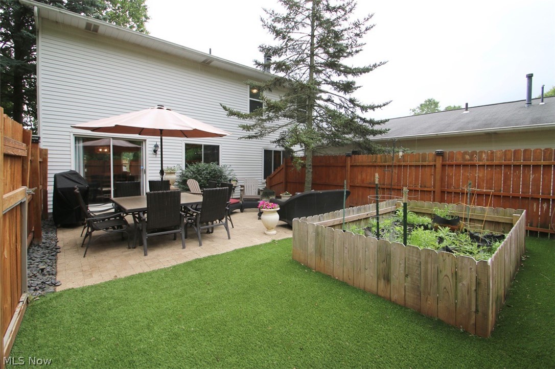 95 Park Road Painesville, OH 44077 - Photo 26 of 27 View of yard with a patio and privacy fencing