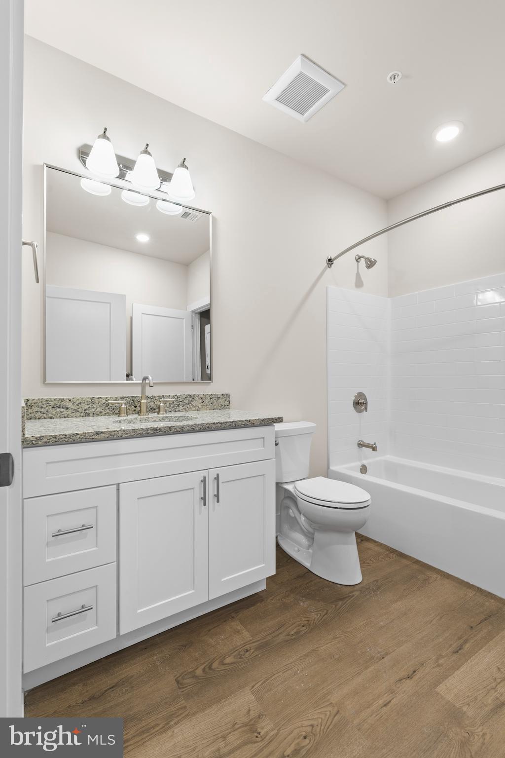 30 West Broad Street Souderton, PA 18964 - Photo 11 of 40 a bathroom with a sink a toilet and bathtub