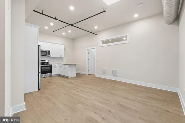 a black and white building with a outdoor space