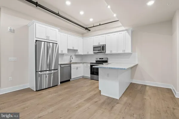 a bath room with a dryer and washer