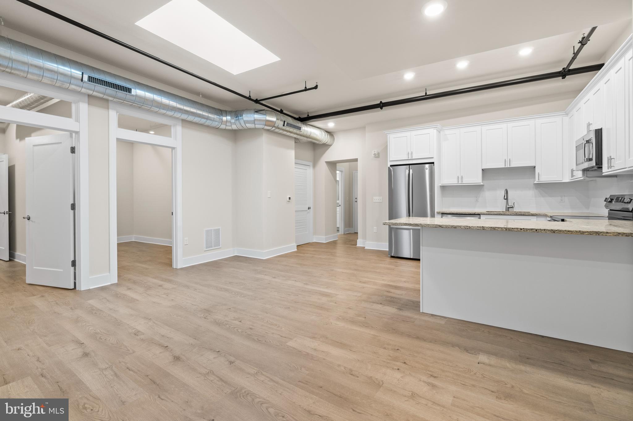 30 West Broad Street Souderton, PA 18964 - Photo 20 of 40 a view of large kitchen with granite countertop cabinets and refrigerator