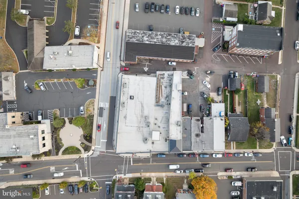 a front view of a building with parking space